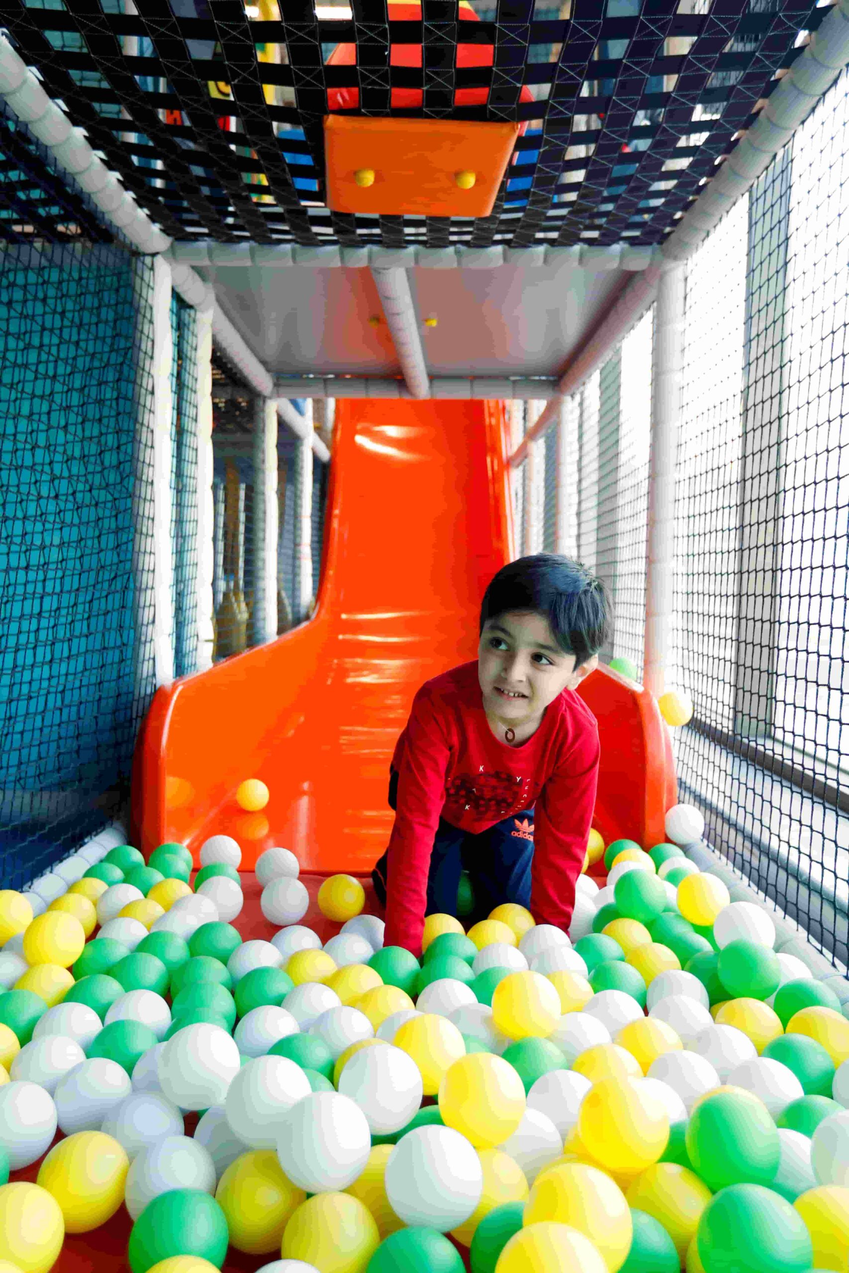 Child enjoying a play attraction