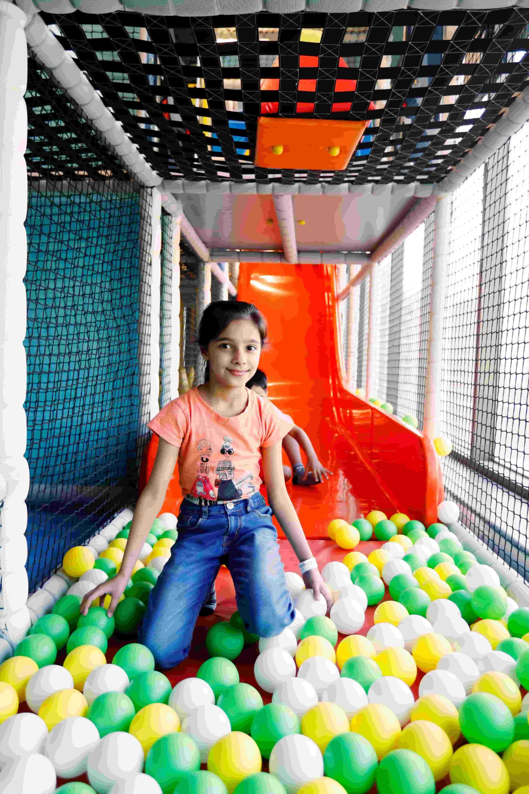 Girl smiling after the real Tingaland drop slide