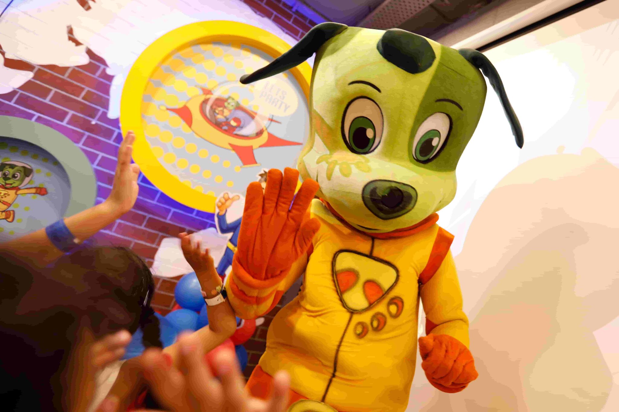Tinga mascot parade with children